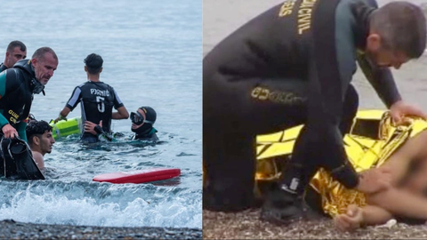 Agentes del GEAS rescatando inmigrantes en el mar.